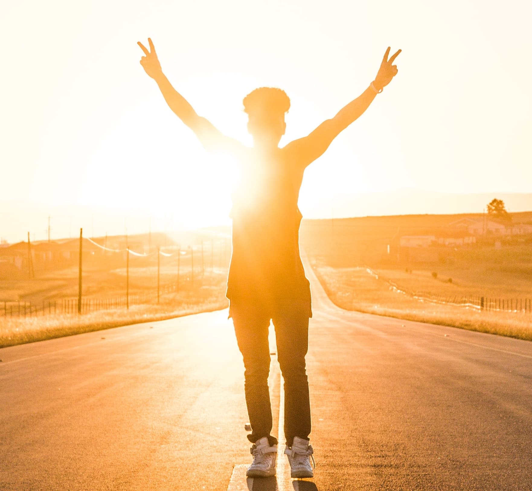 Silhouette flashing victory sign